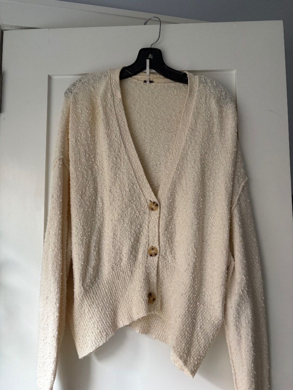 A cream cardigan that goes with everything! Free People!